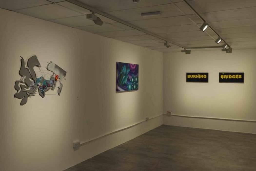 A gallery wall features a metallic abstract sculpture, a vibrant purple and green painting, and two black-and-yellow text pieces reading “Burning Bridges.”